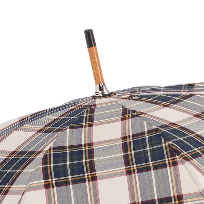 Close-up of plaid umbrella with wooden handle tip and metal ferrule on white background