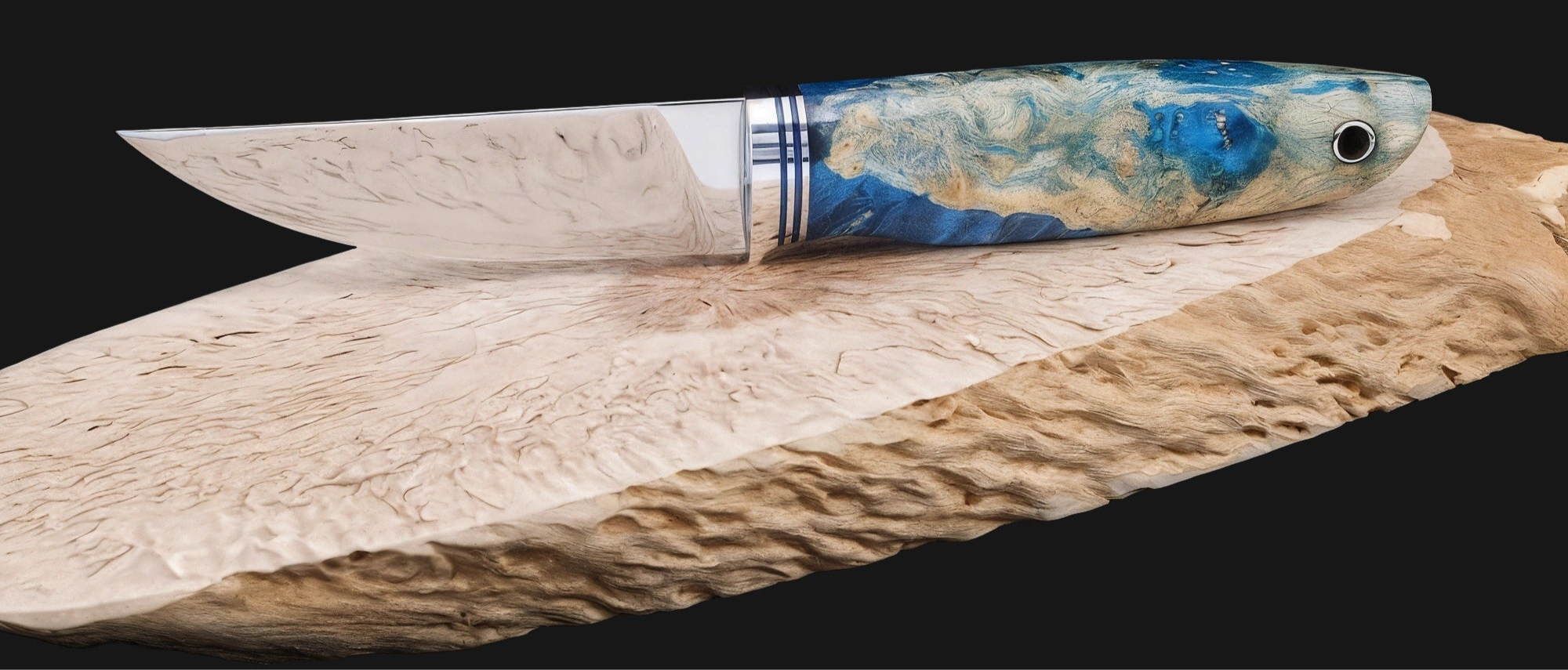 Knife with a decorative handle on a wooden surface