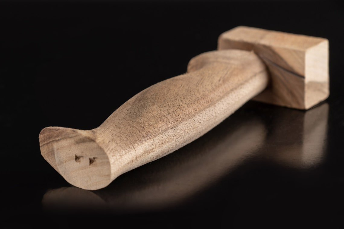 Carved wooden knife handle