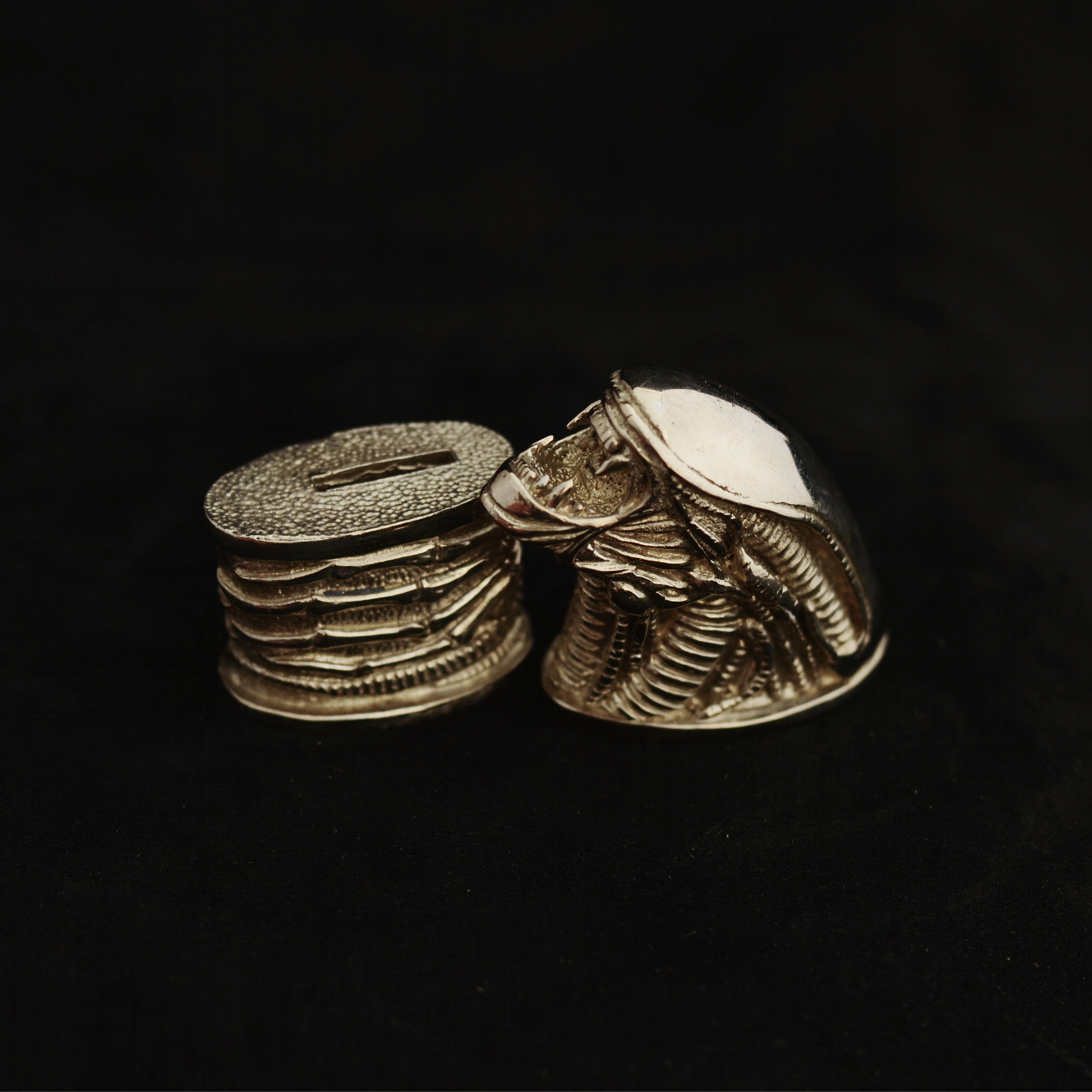 Knife guards, bolsters and pommels of bronze