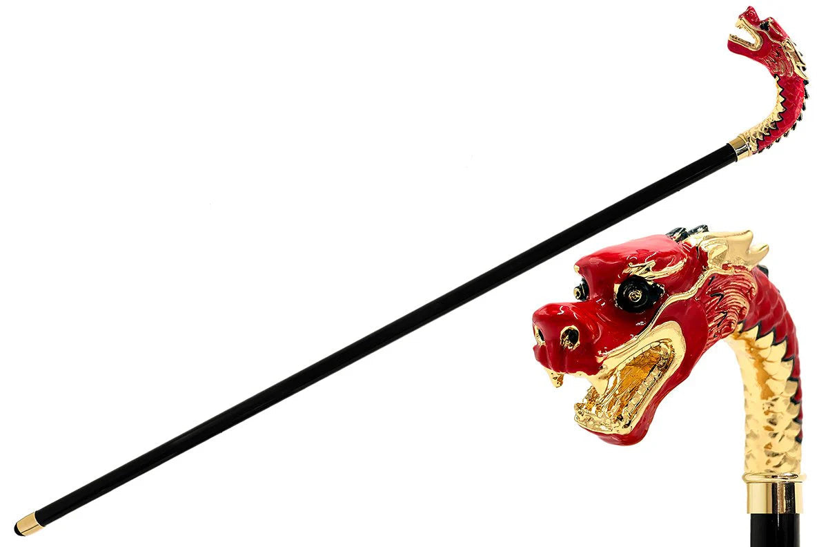 Decorative walking cane with red dragon head handle on a white background, featuring the brand 'Il Marchesato'.