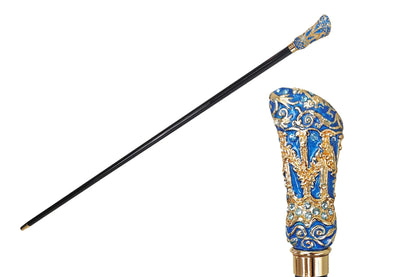 Decorative cane with blue and gold handle on a white background, featuring the brand 'il Marchesato'.