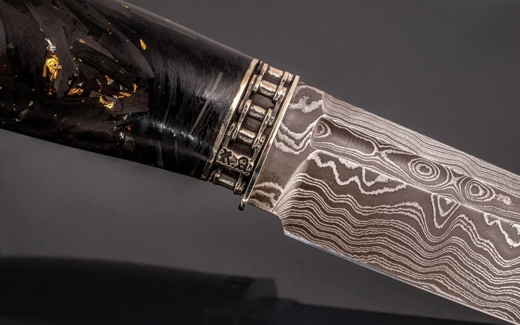unique Damascus steel knife with chopped carbon fiber handle